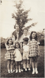 Mom and her brothers and sisters and Aunt Irene. Mom is the one pulling her little sister's hair. 